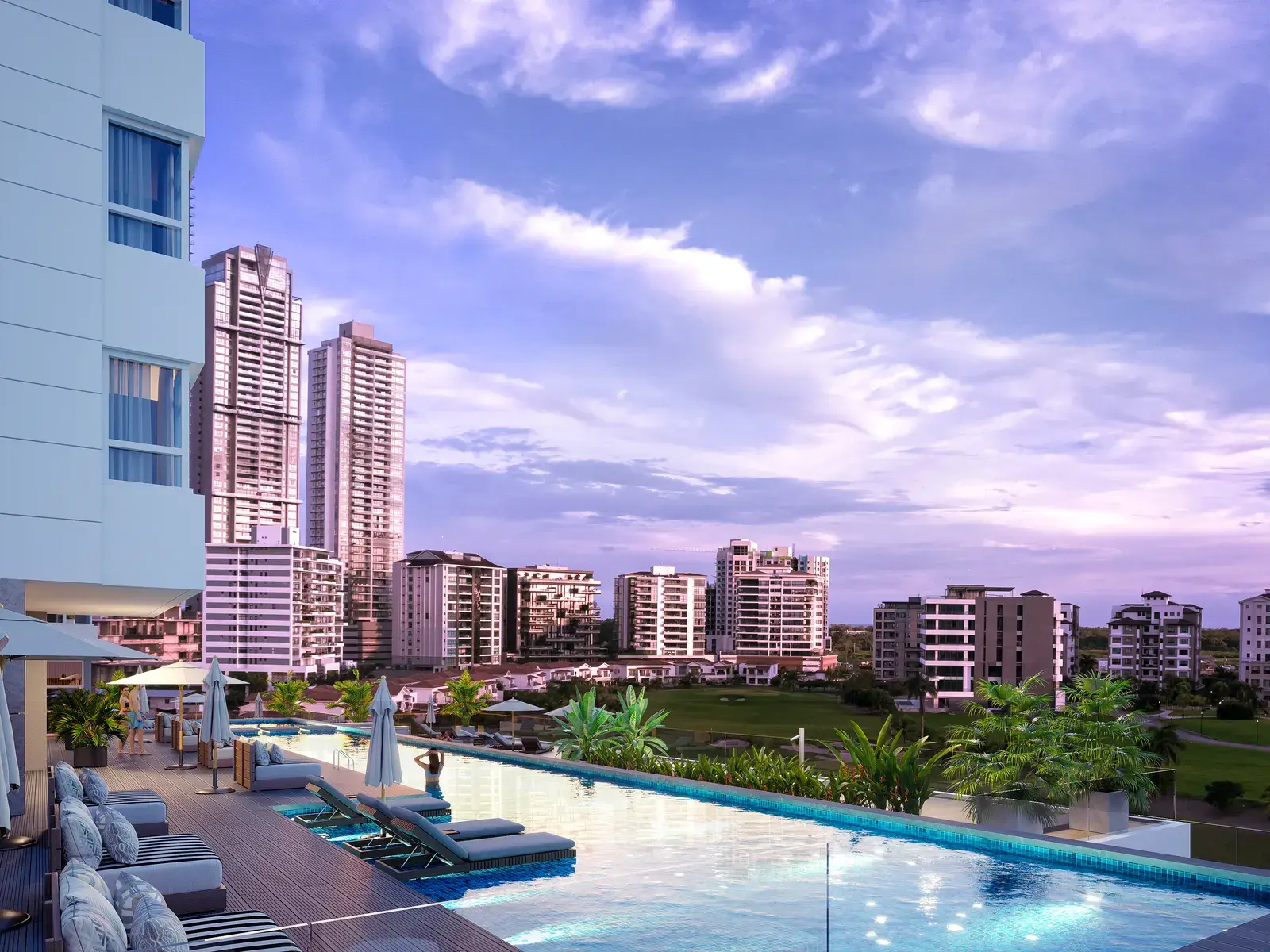 Guayacán's pool terrace, looking across the water to the Panama City skyline at sunset