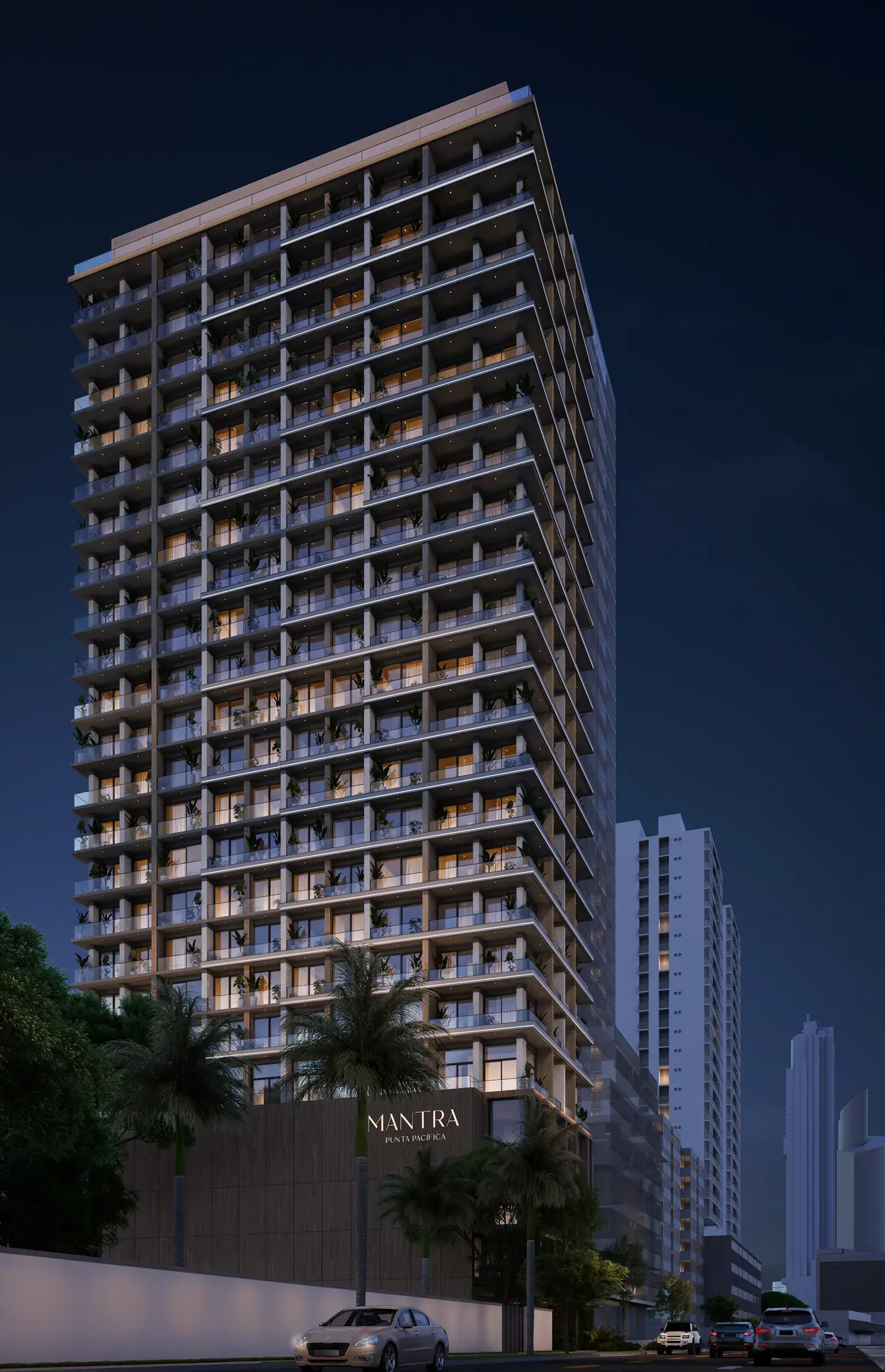The Mantra tower at dusk, its balconies stepping the full height of the facade