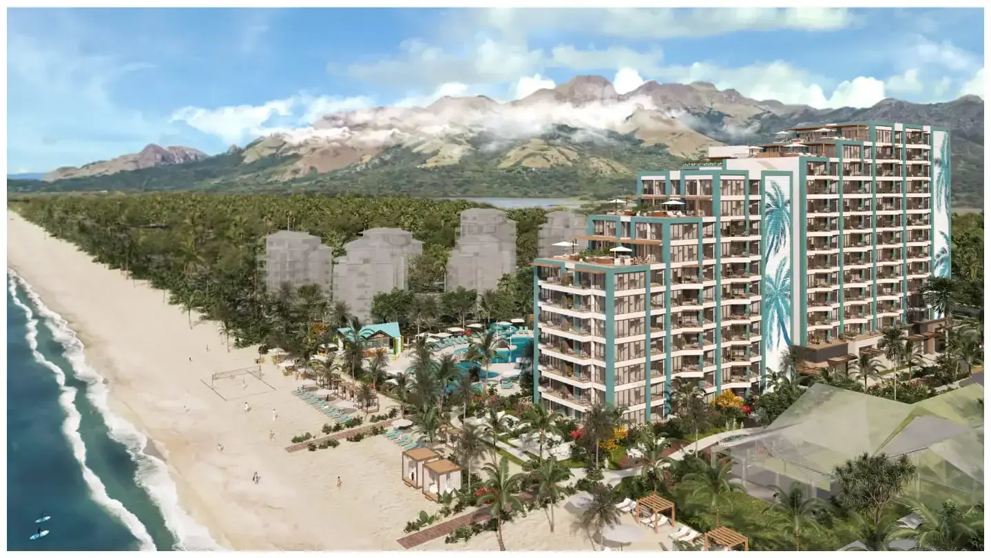 Aerial rendering of Margaritaville at Playa Caracol, the resort buildings set behind the beach with hills beyond