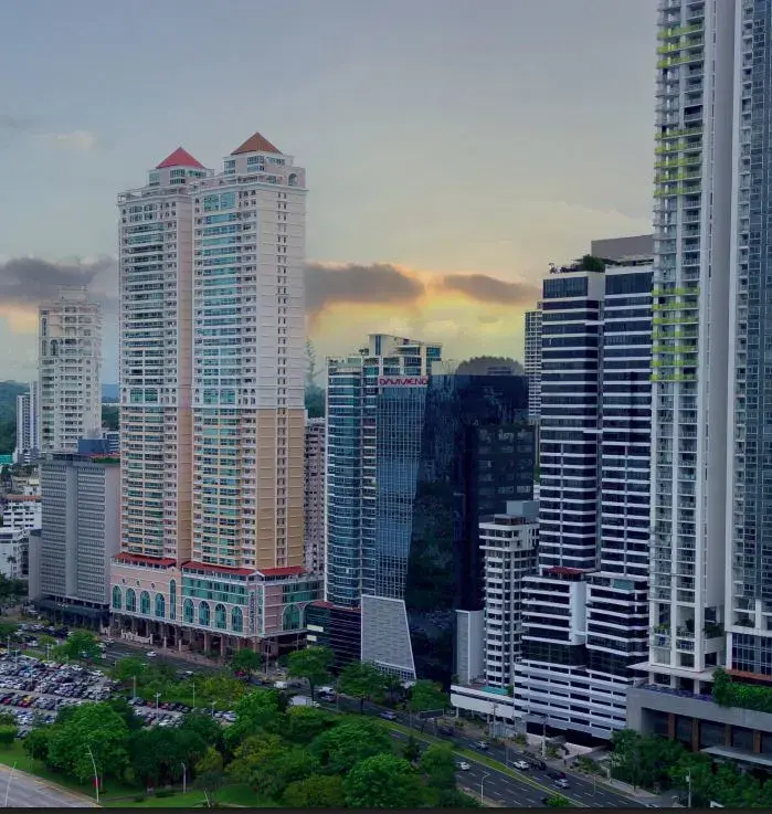 The Calle Uruguay and Punta Paitilla skyline at sunset, dense with high-rise towers