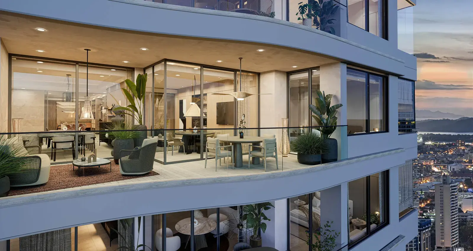 The curved glazed corner of the Tagua building, with balconies and planting
