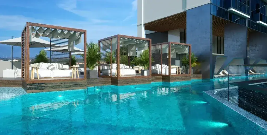 Generation Tower's pool deck, with timber pergolas and cabanas alongside the water