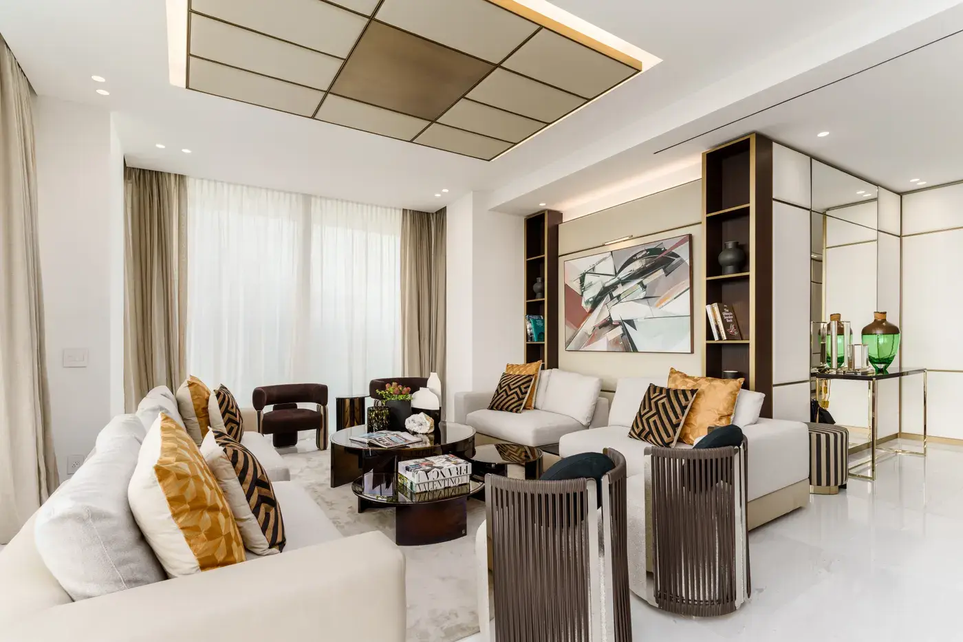 The Fendi-decorated model apartment on the 24th floor, with a bronzed mirrored ceiling panel, pale marble floors and patterned Fendi cushions
