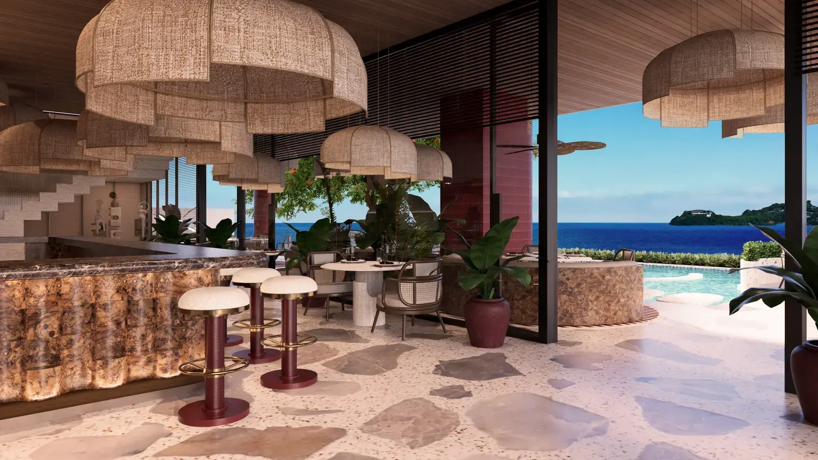 The Nautilus bar, with woven pendant shades and doors opening onto the pool and the sea
