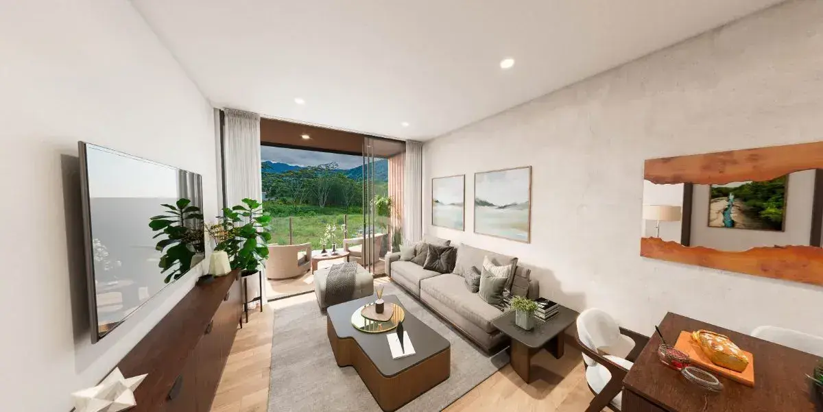 A Towncenter living room, with a sofa, low table and sliding doors onto a planted terrace